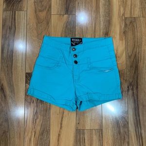 Turquoise high waisted shorts.
